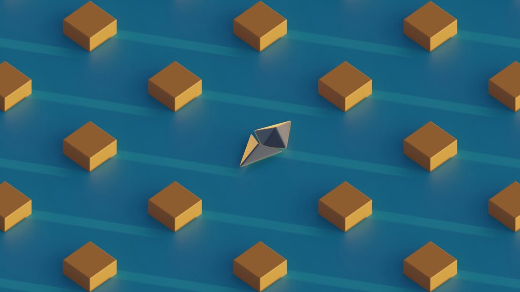 Pattern design with silver Ethereum symbol and gold cubes on blue background.