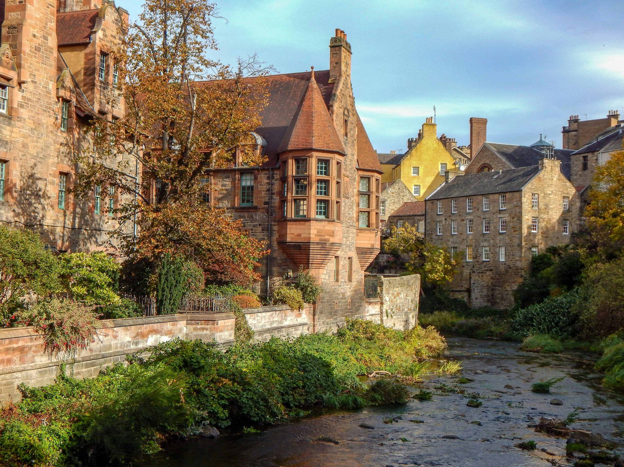 River and Scottish architecture in a village.